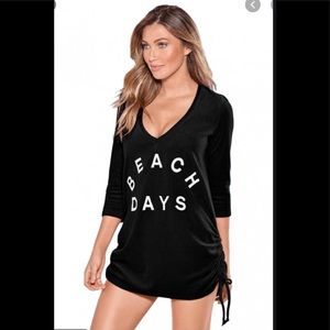 Beach top in black with white lettering.